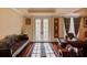 Basement sitting area with French doors and ornate bench at 5004 Gunnison Trce, Suwanee, GA 30024