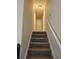 Carpeted staircase leading to the upper level of the home at 1378 Mill Lake Cir, Stone Mountain, GA 30088