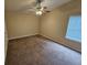 Large bedroom with ceiling fan and brown carpet at 1378 Mill Lake Cir, Stone Mountain, GA 30088