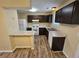 Modern kitchen with dark cabinets, laminate countertops, and white appliances at 1378 Mill Lake Cir, Stone Mountain, GA 30088