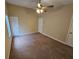 Spacious bedroom with ceiling fan and brown carpet at 1378 Mill Lake Cir, Stone Mountain, GA 30088