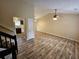Open living room with vaulted ceiling, hardwood floors, and access to kitchen at 1378 Mill Lake Cir, Stone Mountain, GA 30088