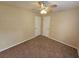 Spacious bedroom with ceiling fan and neutral carpeting at 1378 Mill Lake Cir, Stone Mountain, GA 30088