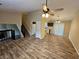 Spacious living room with vaulted ceilings, hardwood floors, and kitchen view at 1378 Mill Lake Cir, Stone Mountain, GA 30088