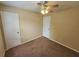 Well-lit bedroom with ceiling fan and two closets at 1378 Mill Lake Cir, Stone Mountain, GA 30088