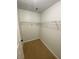 Walk-in closet with wire shelving; carpeted floor at 2080 Winding Crossing Trl, Fairburn, GA 30213