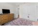 Bedroom with wood dresser and Eiffel Tower bedding at 719 Sara Meadow Rd, Loganville, GA 30052