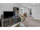 Bonus room with TV, entertainment center, and window at 719 Sara Meadow Rd, Loganville, GA 30052