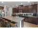 Modern kitchen with dark cabinetry, granite countertops and breakfast bar at 719 Sara Meadow Rd, Loganville, GA 30052