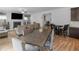 Open concept dining area with wood table and chairs at 719 Sara Meadow Rd, Loganville, GA 30052
