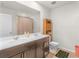 Bathroom with double vanity and a brown cabinet at 719 Sara Meadow Rd, Loganville, GA 30052