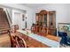 Formal dining room with a large wood table and hutch at 719 Sara Meadow Rd, Loganville, GA 30052