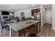 Kitchen island with granite countertop, double sink, and a breakfast bar with seating at 719 Sara Meadow Rd, Loganville, GA 30052