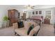 Large main bedroom with a king-size bed, walk-in closet, and sitting area at 719 Sara Meadow Rd, Loganville, GA 30052