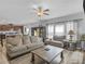 Relaxing living room with fireplace and ample seating at 719 Sara Meadow Rd, Loganville, GA 30052