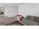 Bright playroom with a comfy couch and plenty of space for  at 719 Sara Meadow Rd, Loganville, GA 30052