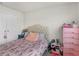 Bedroom with a pink dresser and Eiffel Tower bedding at 719 Sara Meadow Rd, Loganville, GA 30052