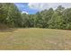 Large backyard with open space and trees at 2000 Enon Sw Rd, Atlanta, GA 30331