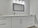 Modern bathroom vanity with quartz countertop and updated fixtures at 2000 Enon Sw Rd, Atlanta, GA 30331
