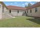 Private courtyard with grassy area and brick walls at 2000 Enon Sw Rd, Atlanta, GA 30331