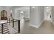 Long hallway with hardwood floors, leading to dining and living areas at 2000 Enon Sw Rd, Atlanta, GA 30331
