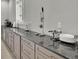 Modern kitchen with extensive granite countertops and stainless steel appliances at 2000 Enon Sw Rd, Atlanta, GA 30331