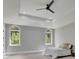 Spacious main bedroom with high ceilings, large windows, and ceiling fan at 2000 Enon Sw Rd, Atlanta, GA 30331