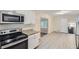Updated kitchen features stainless steel appliances and granite countertops at 3189 Dogwood Dr, Atlanta, GA 30344