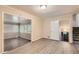 Spacious living room with wood-look floors and sunroom access at 3189 Dogwood Dr, Atlanta, GA 30344