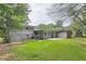 Spacious backyard with a large grassy area and patio at 3189 Dogwood Dr, Atlanta, GA 30344