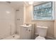 Simple bathroom with shower, toilet and vanity at 3189 Dogwood Dr, Atlanta, GA 30344