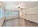 Sunroom features wood-look floors, multiple windows, ceiling fan and exposed brick at 3189 Dogwood Dr, Atlanta, GA 30344