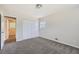 Bedroom with neutral walls, grey carpet, and built-in closet at 3189 Dogwood Dr, Atlanta, GA 30344