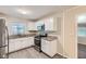 Modern kitchen with white cabinets and granite countertops at 3189 Dogwood Dr, Atlanta, GA 30344