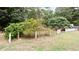 Backyard garden area with a variety of plants and a white picket fence at 2079 Pinehurst Rd, Snellville, GA 30078