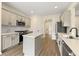 Modern kitchen with gray cabinets, white quartz countertops, and stainless steel appliances at 1015 Forest Creek Dr, Canton, GA 30115