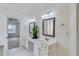 Bright bathroom with double sinks, and a view into another room at 4069 High Country Dr, Douglasville, GA 30135