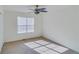 Well-lit bedroom with ceiling fan and carpet flooring at 4069 High Country Dr, Douglasville, GA 30135