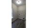 Bright laundry room with vinyl flooring and ample shelving at 3210 Franklin St, Austell, GA 30106