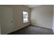 Simple bedroom with neutral walls and carpeted floor at 3210 Franklin St, Austell, GA 30106