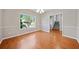 Bright dining room with hardwood floors and large window at 5820 Broadleaf Way, Atlanta, GA 30349