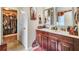 Double vanity bathroom with a large closet at 7619 Sugar Plum Ln, Lithonia, GA 30038