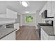 Open concept kitchen with granite counters and stainless steel appliances at 4050 Harvest Ridge Dr, Douglasville, GA 30135