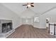 Spacious living room with vaulted ceiling, fireplace, and hardwood floors at 4050 Harvest Ridge Dr, Douglasville, GA 30135