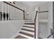 Two-story entryway with hardwood floors and a wooden staircase at 4050 Harvest Ridge Dr, Douglasville, GA 30135