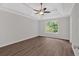 Spacious bedroom with wood-look floors and ceiling fan at 4050 Harvest Ridge Dr, Douglasville, GA 30135