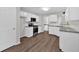 Modern kitchen with white cabinets, granite counters, and stainless steel appliances at 4050 Harvest Ridge Dr, Douglasville, GA 30135