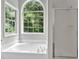 Bathroom with garden tub and large window at 4050 Harvest Ridge Dr, Douglasville, GA 30135