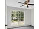 Well-lit bedroom with large window and grey carpet at 4050 Harvest Ridge Dr, Douglasville, GA 30135