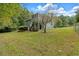 Back of house showing screened porch and yard at 4050 Harvest Ridge Dr, Douglasville, GA 30135